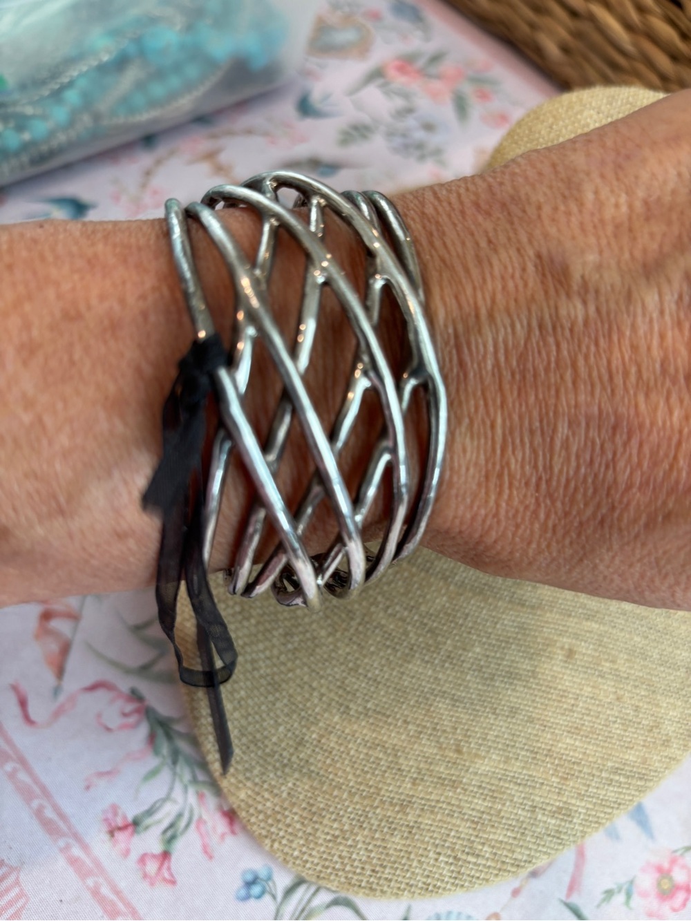 Erica Lyons Silver-Tone Wide Lattice Openwork Cuff Bracelet. It features a moder